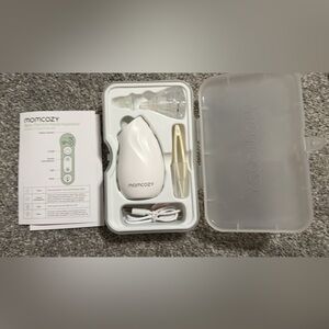 White Momcozy nasal aspirator. New
